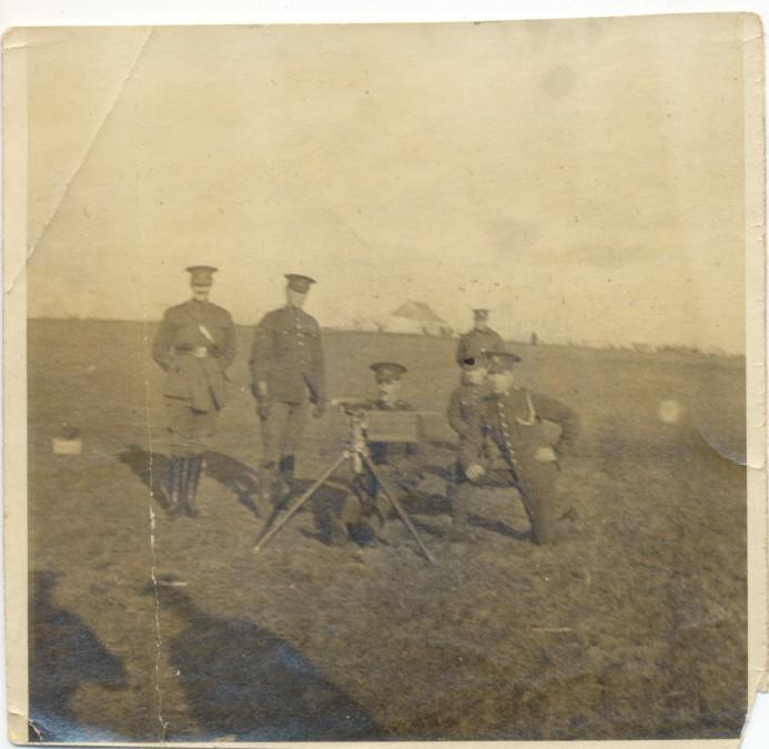 Peter &amp; comrades posing with
the "Colt" which in Peter's own
words he describes as a "death trap"
Peter is the one directly behind 
the "Colt"
Front